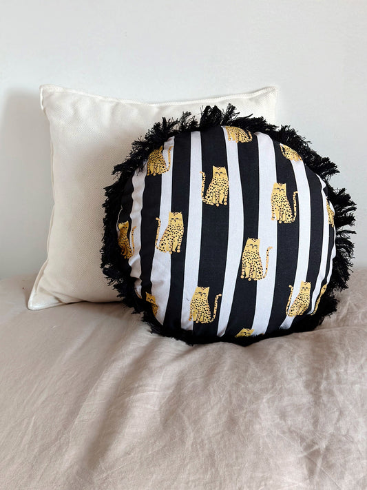 fat cat round cushion with fringes, yellow cat + black and white stripes.