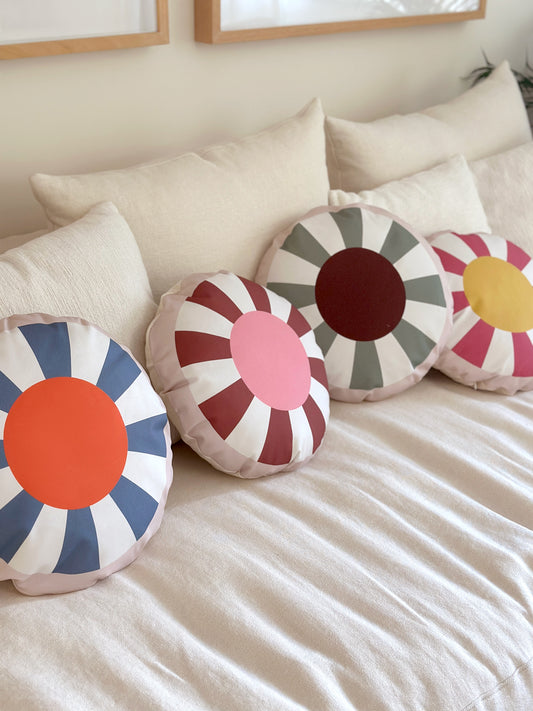 TOM round decorative cushion with vibrant geometric patterns, made from organic cotton, eco-friendly, perfect for kids' rooms and modern home decor.