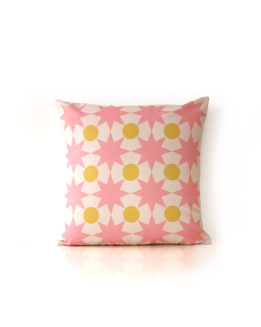 Star Point geometric decorative cushion in pink and yellow, made from organic cotton, eco-friendly, perfect for kids' rooms and modern home decor.